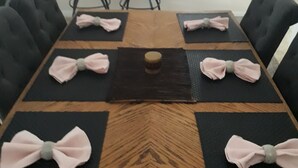 A dining table set with placemats and napkins. - Free pool heat June, July, August Keyvilla-The Disney Retreat, 5 bed pool home.  (davenport)