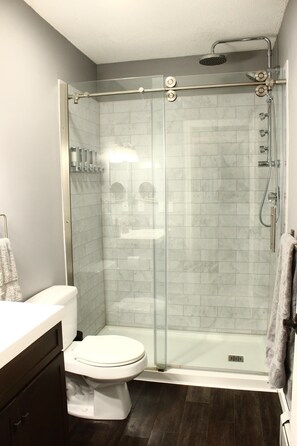 Shower, hair dryer, towels, soap
