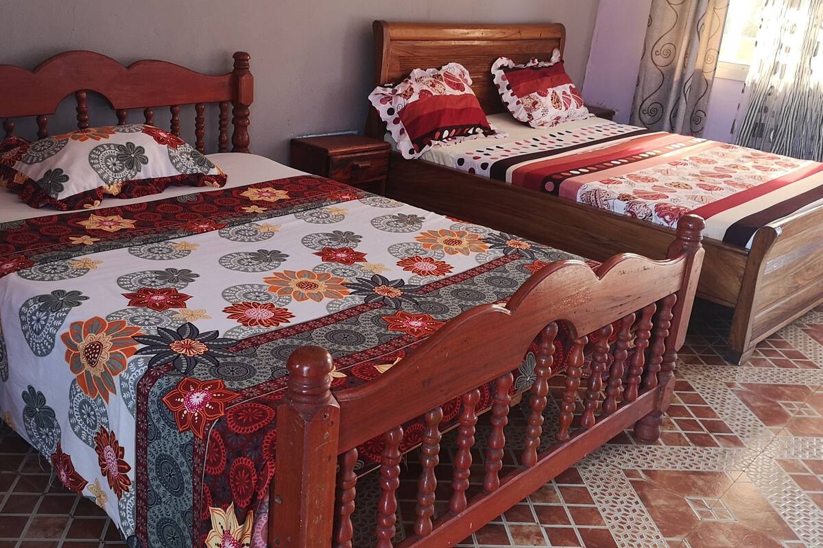 Desk, laptop workspace, blackout curtains, bed sheets