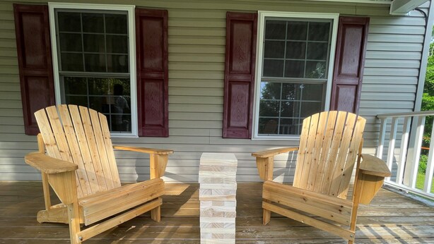 A wooden deck with two Adirondack chairs and a small table. - Your Home away from Home. Large Groups Welcome (Hamden)