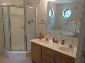 Combined shower/tub, hair dryer, towels, soap