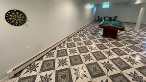 A room with a dartboard, pool table, and patterned floor tiles. - Your Home away from Home. Large Groups Welcome (Hamden)