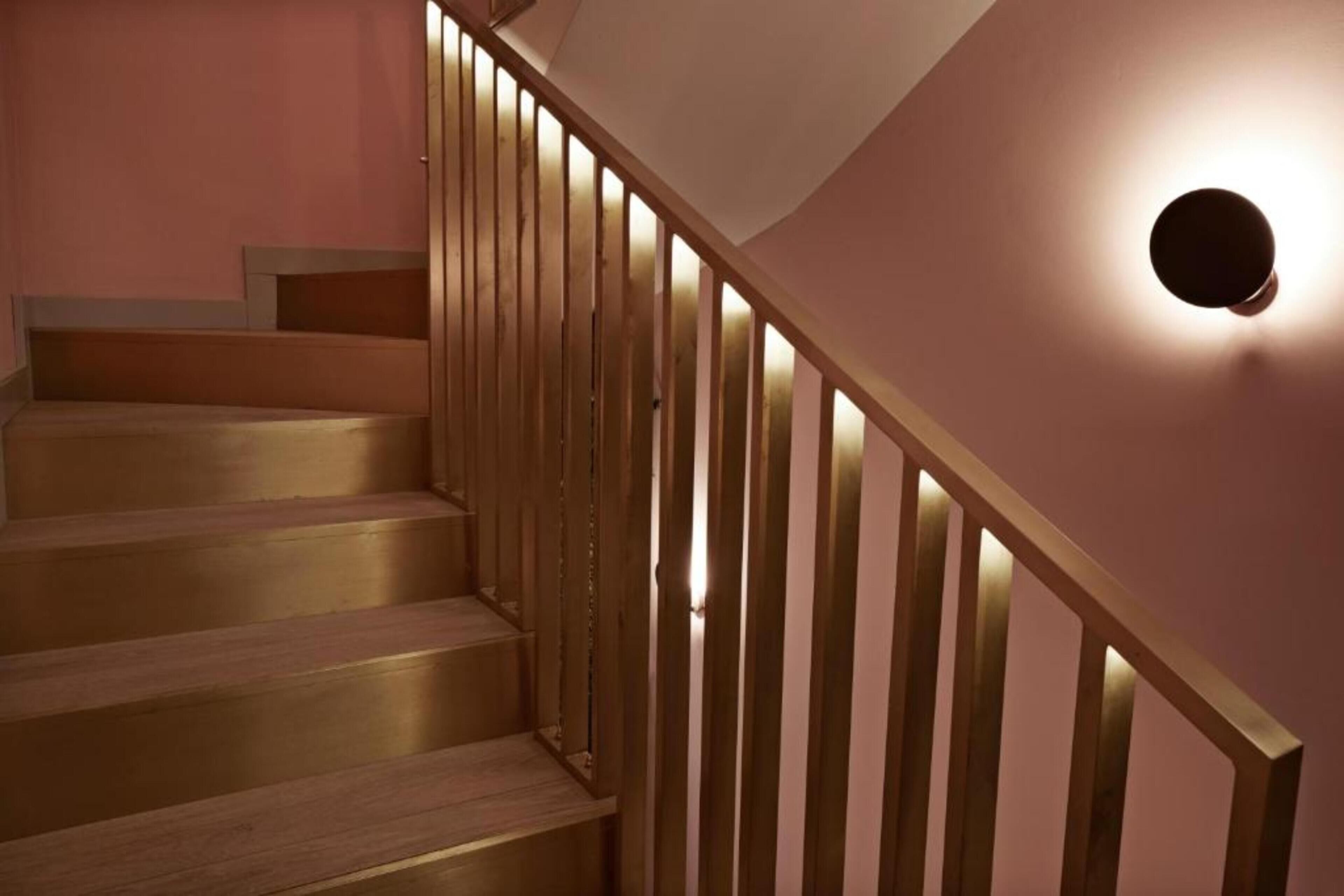 A staircase with wooden steps and a railing.