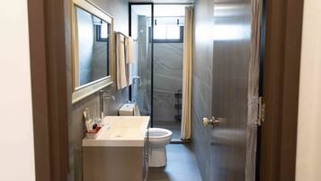 Shower, hair dryer, slippers, towels