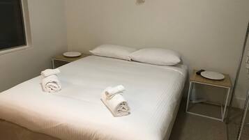 Premium bedding, blackout curtains, iron/ironing board, free WiFi