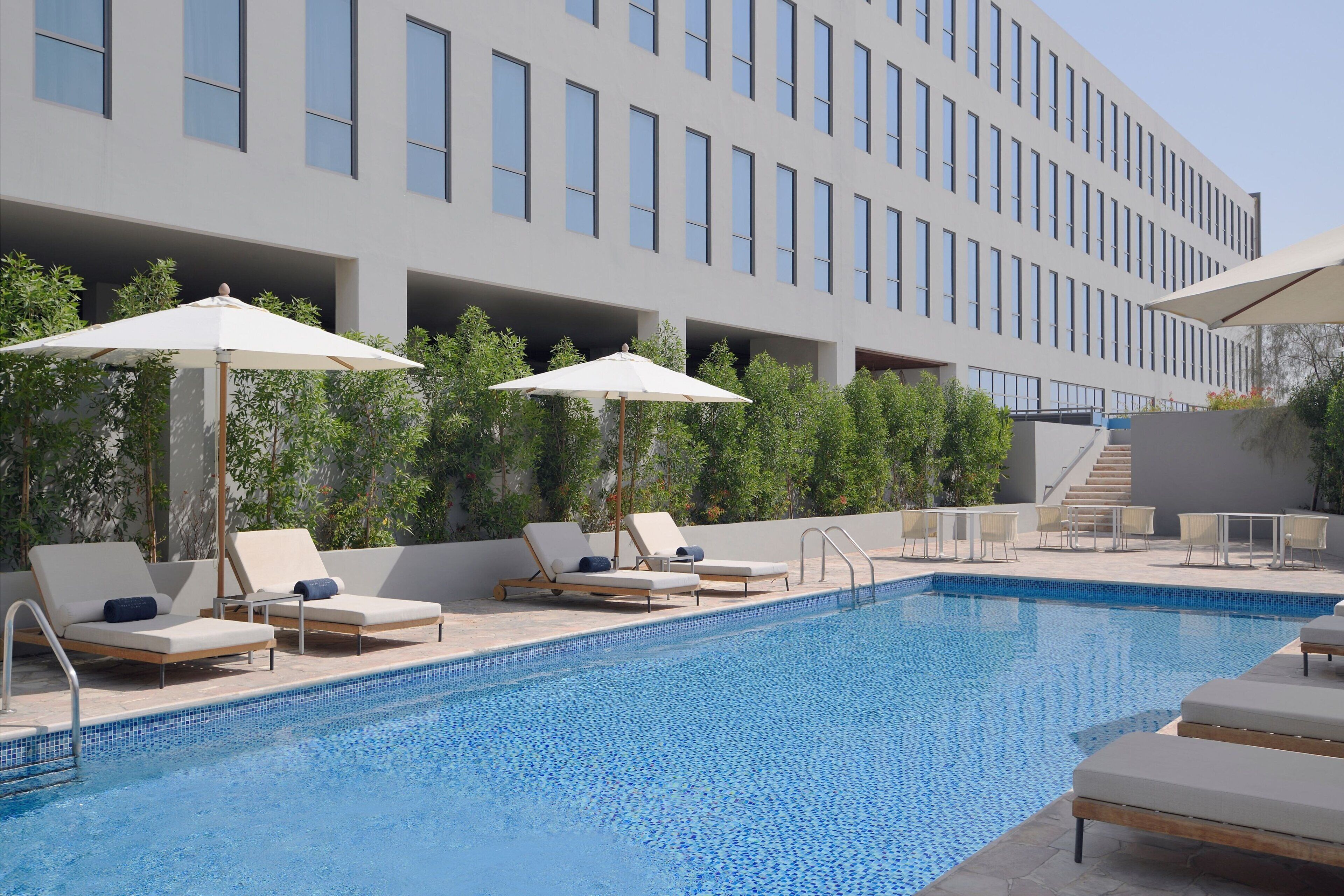 outdoor pool, pool umbrellas, pool loungers