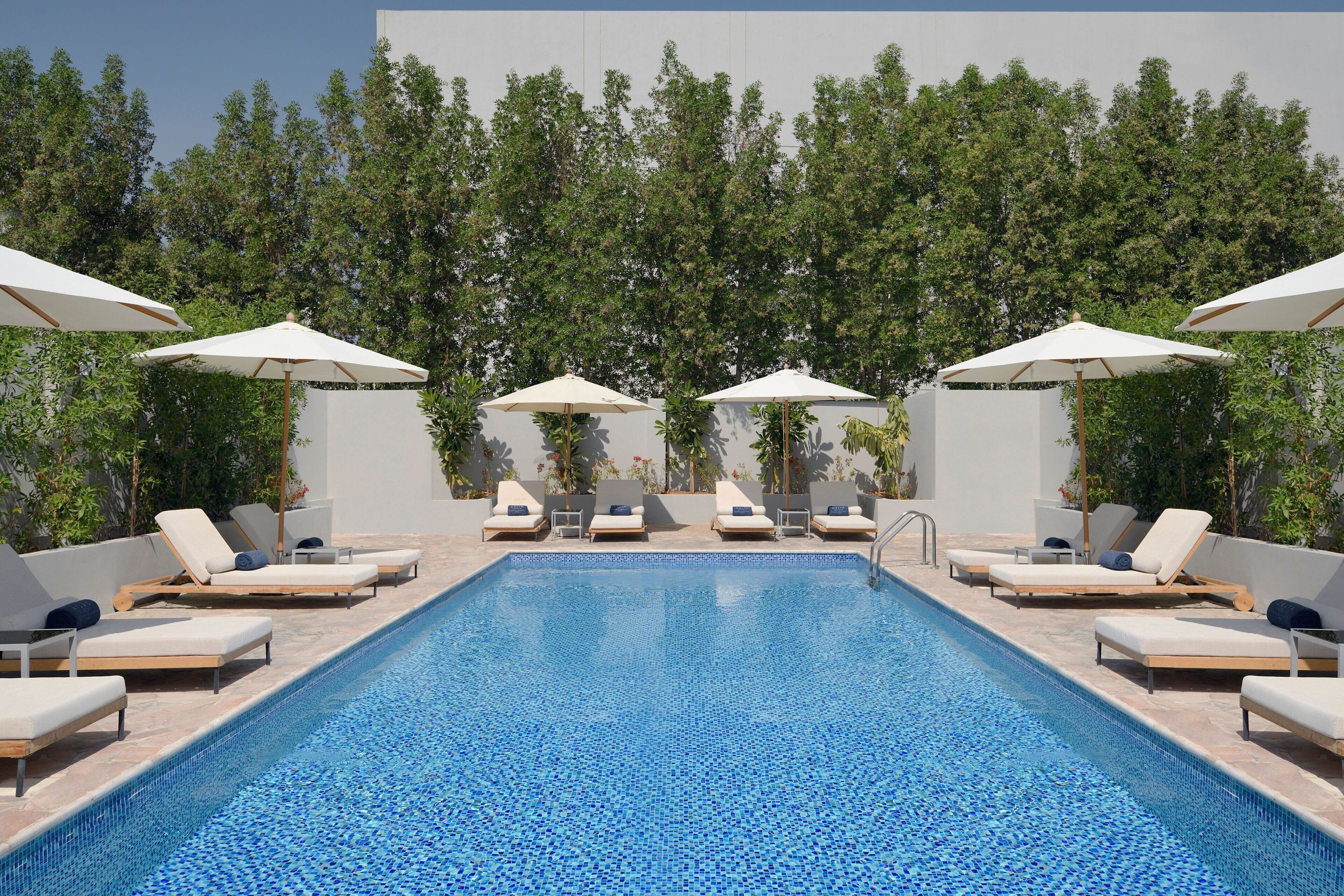 Outdoor pool, pool umbrellas, sun loungers