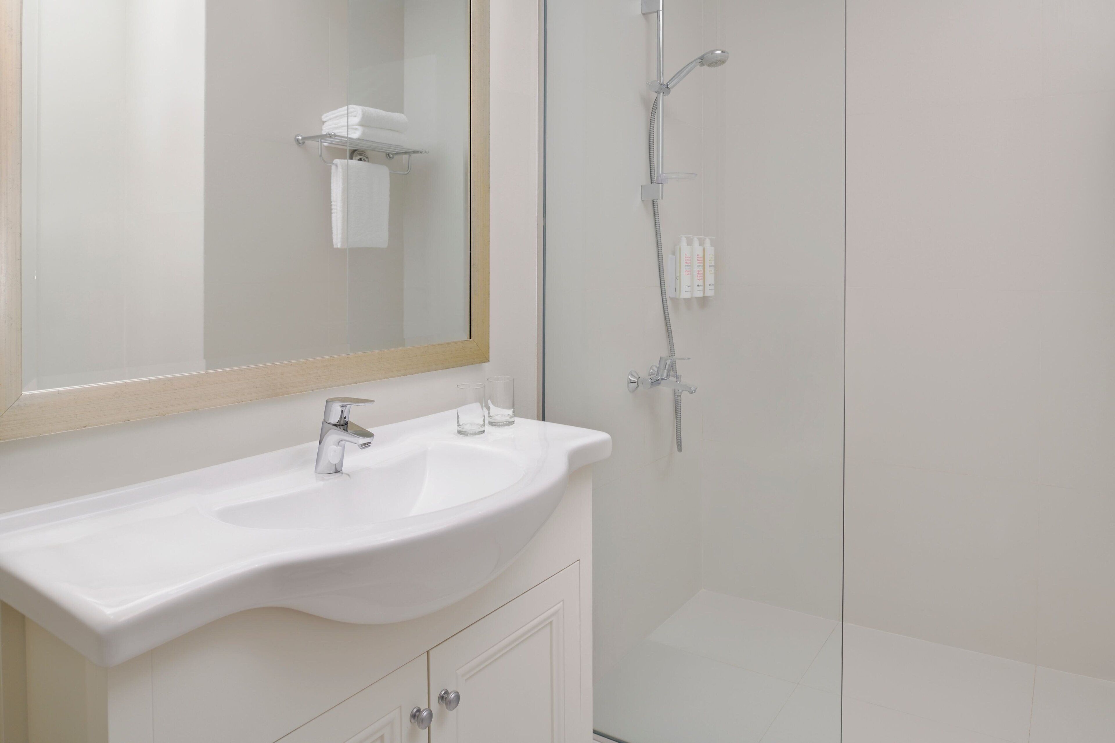 eco-friendly toiletries, hair dryer, bathrobes, slippers