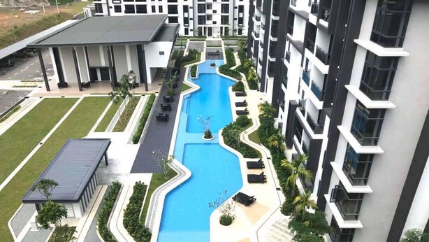 A modern hotel with a central swimming pool, multiple balconies, and a well-maintained garden area. - Greenfield Residence Kota Kinabalu (Kota Kinabalu)