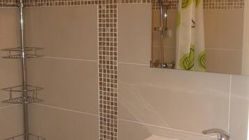 Shower, hair dryer, towels, toilet paper