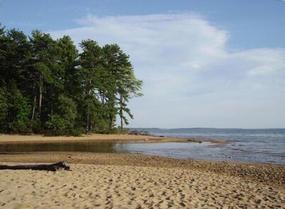 Private setting Sparkling Lake Sebago.  Newly Renovated spring 2025.