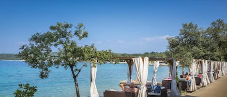 On the beach, sun-loungers, beach towels