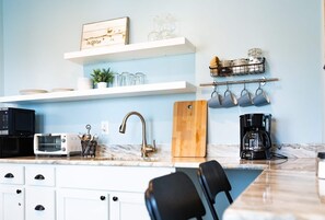 Fridge, microwave, coffee/tea maker, toaster