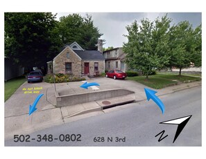 A residential street with houses, a driveway, and a mailbox. - Ron & Orline's Home, park at the door & use our EV 50 amp charger (Bardstown)