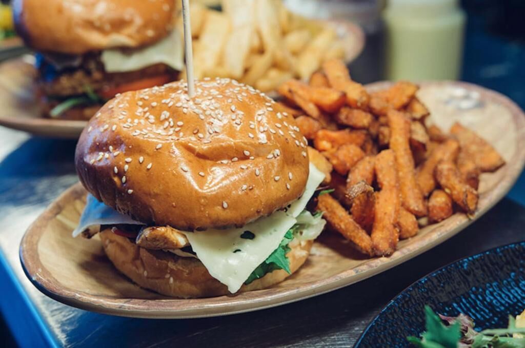 A plate with a burger and fries.