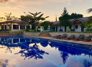 2 outdoor pools, open 7 AM to 10 PM, pool loungers