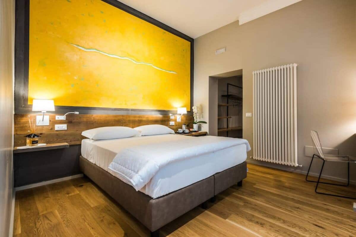 Camera quadrupla, bagno privato | Minibar, una cassaforte in camera, con arredamento individuale