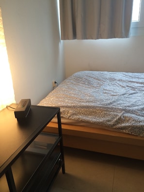 Blackout curtains, iron/ironing board, free WiFi, bed sheets