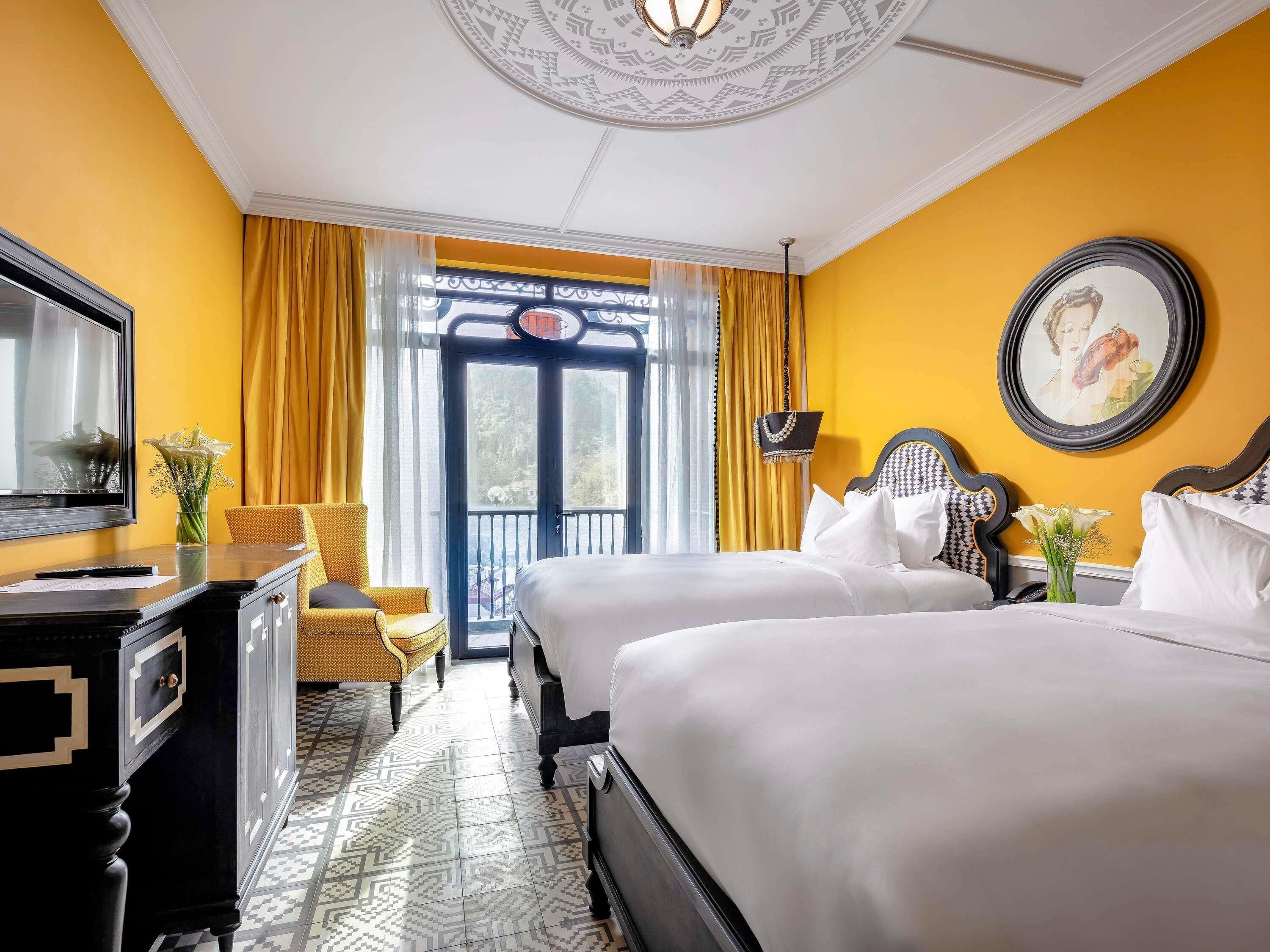 Deluxe kamer, 2 eenpersoonsbedden | Luxe beddengoed, donsdekens, een minibar, een kluis op de kamer