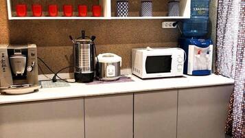 Fridge, microwave, stovetop, cookware/dishes/utensils