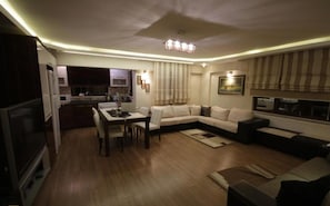 Standard Apartment, 3 Bedrooms, Courtyard View | Living area | LCD TV