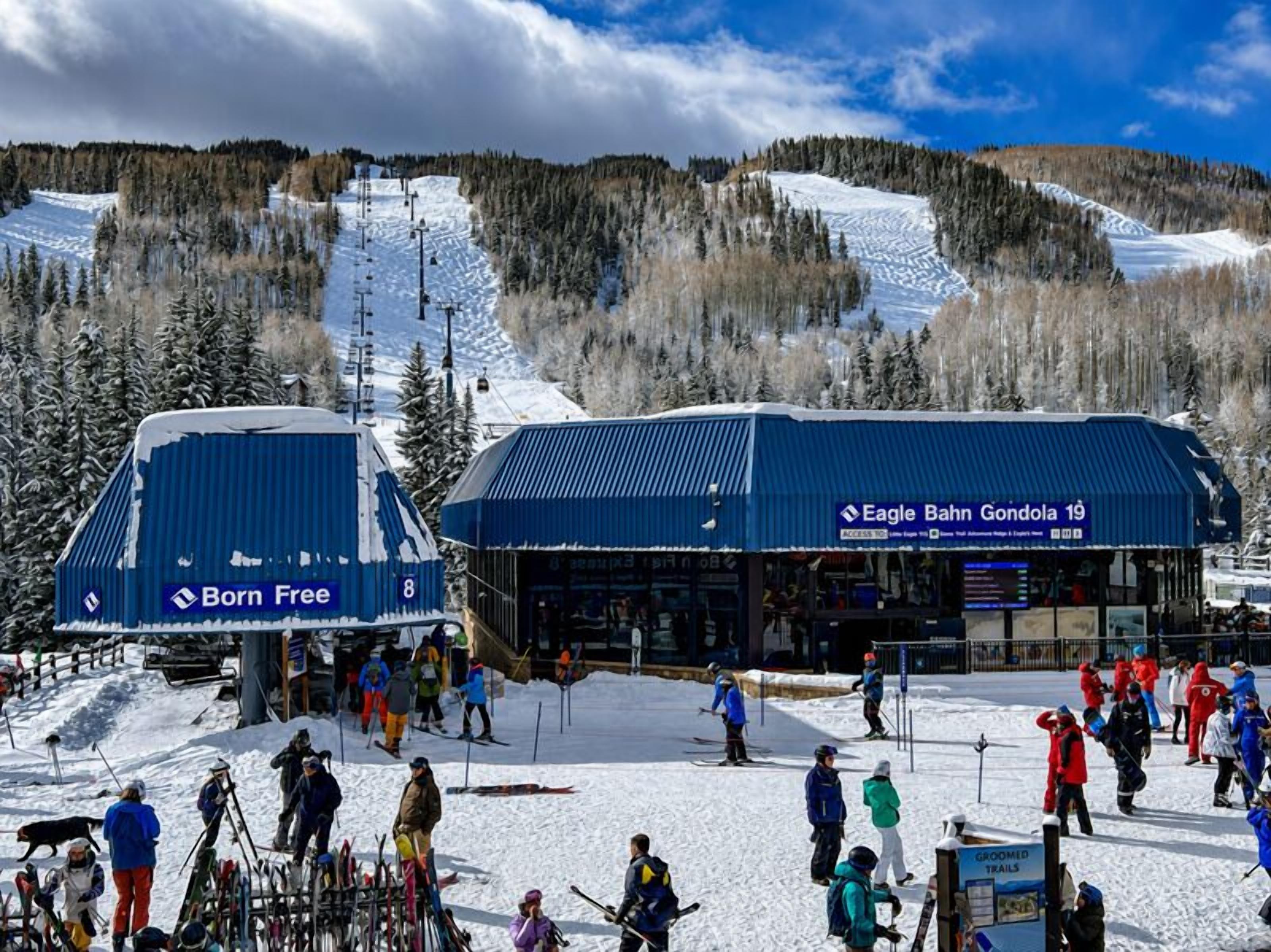 A ski resort with a lodge named 'Eagle Bahn Gondola 19' and a 'Born Free' ski lift.