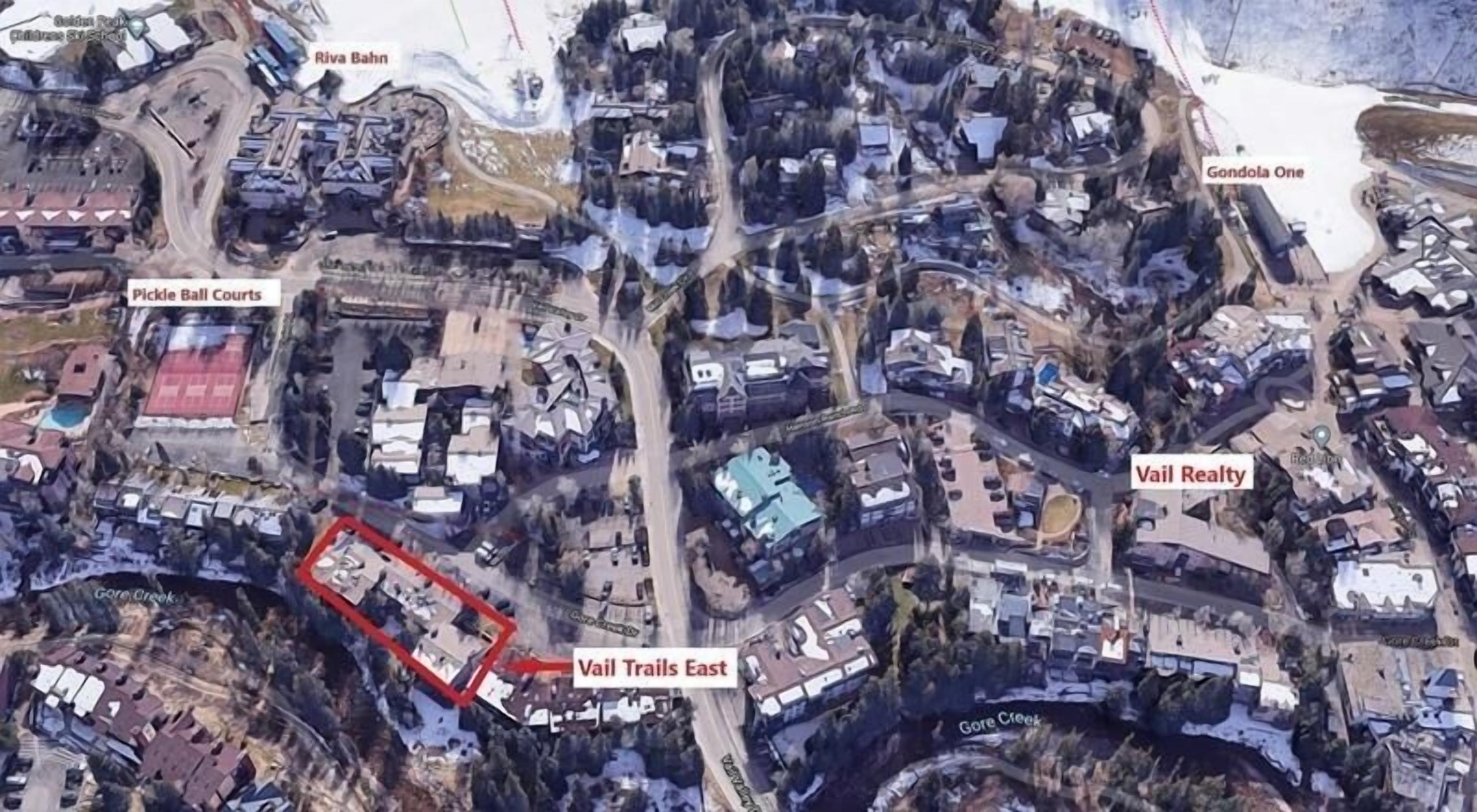 An aerial view of a residential area with labeled properties such as 'Riva Bahn', 'Pickle Ball Courts', 'Gondola One', and 'Vail Realty'.