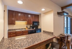 Departamento, 2 habitaciones | Cocina privada | Refrigerador, horno, cafetera y tetera y tostadora 