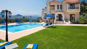 A two-story stone house with a swimming pool, outdoor seating, and a view of the mountains. - Family Villa w/Pool, Billiard ,Ping Pong, BBQ area (Chania)