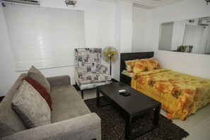 Desk, laptop workspace, bed sheets - Capital & County Apartment Chevron (Lekki)
