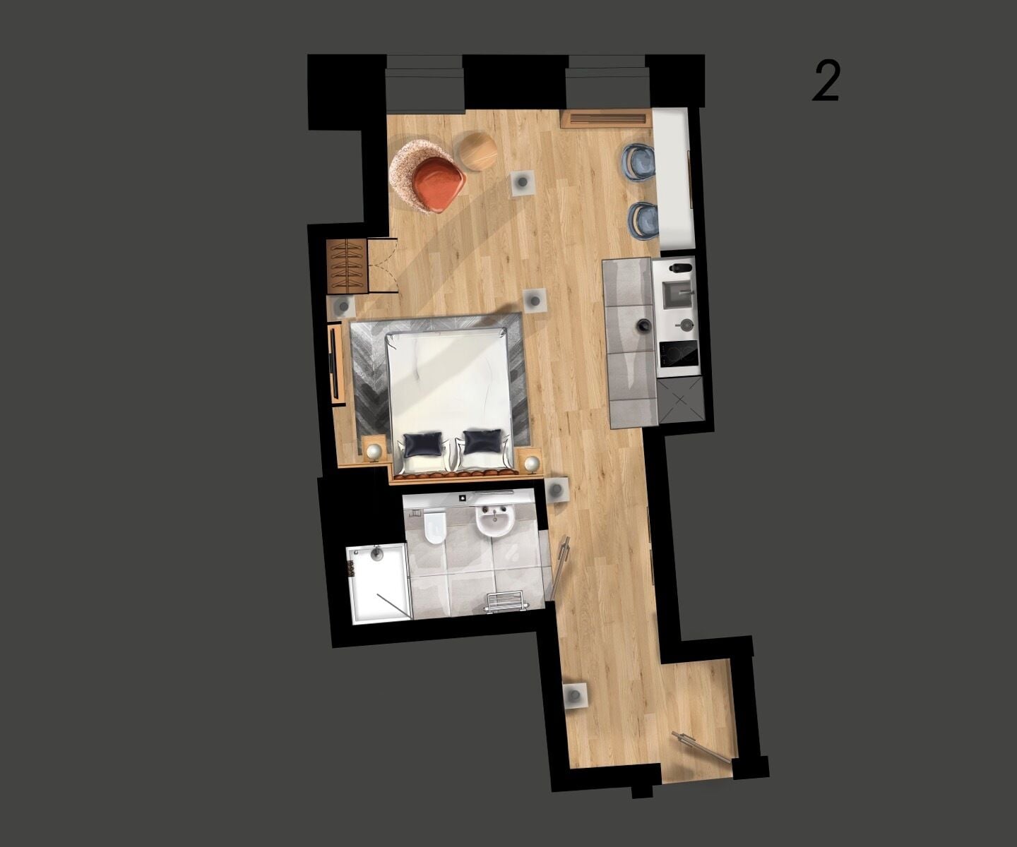 Vue plongeante d’une chambre d’hôtel comprenant un lit, une petite salle de bain, une kitchenette et un coin salon avec une table et des chaises.