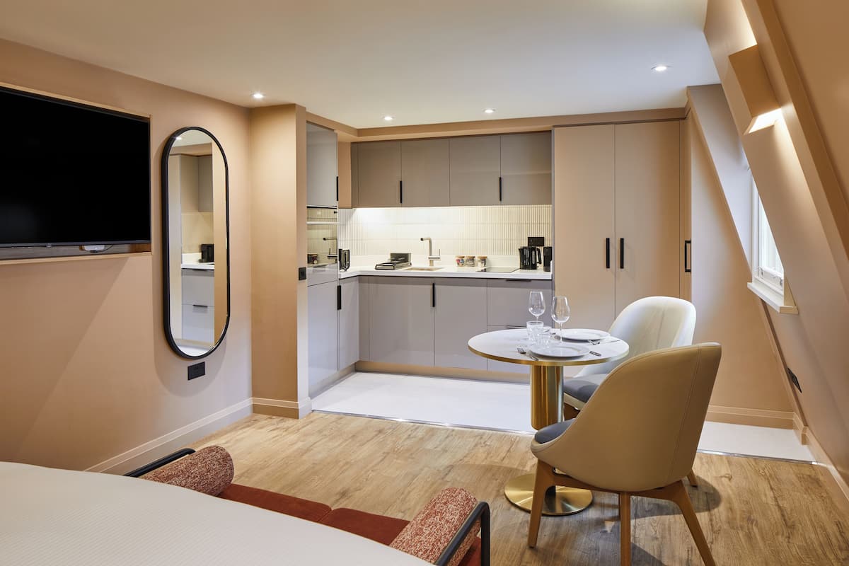 Enjoy a compact retreat with a flat-screen TV, dining area, and kitchenette.