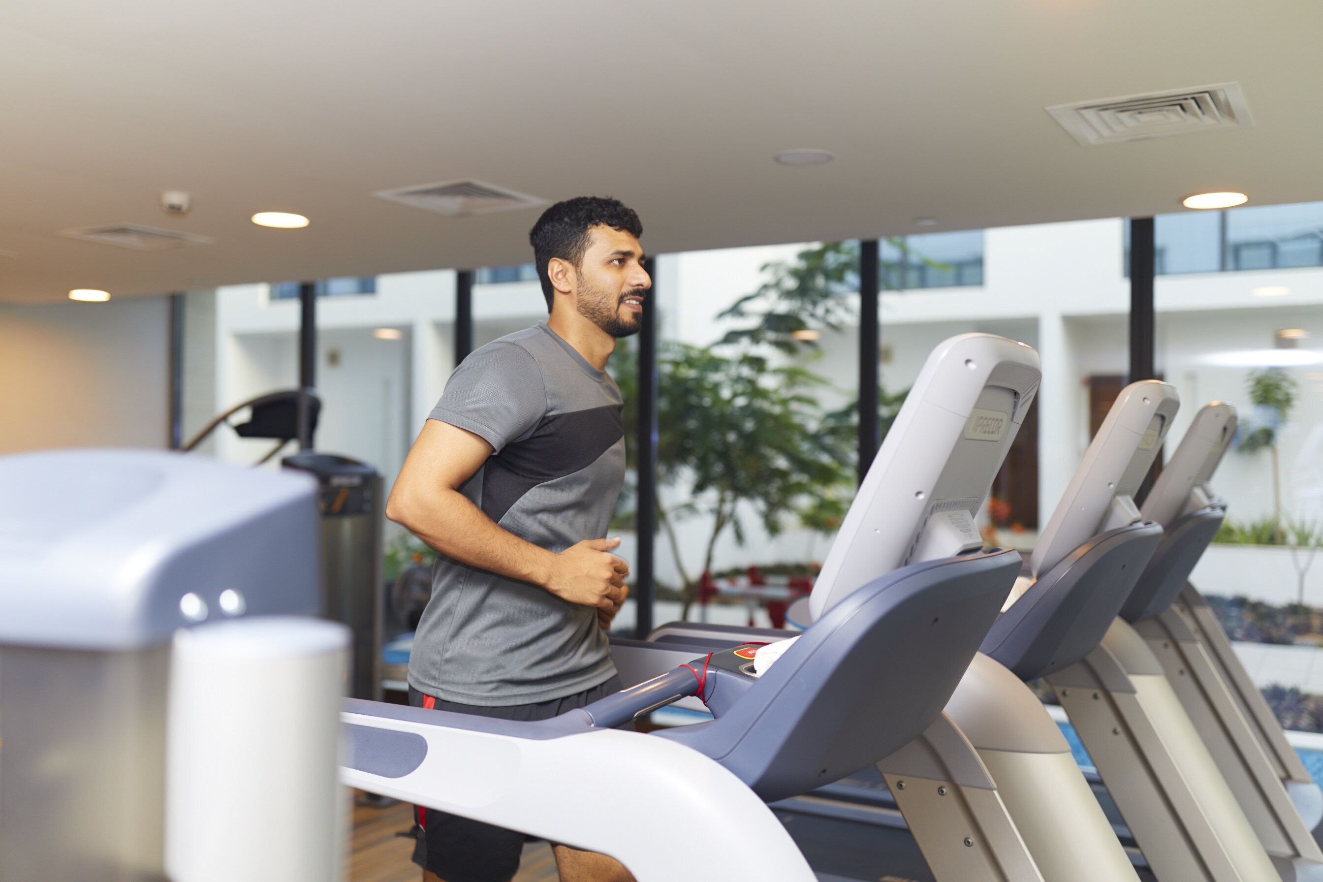 A gym with treadmills and exercise equipment.
