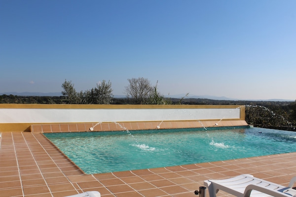 Outdoor pool, pool umbrellas, sun loungers