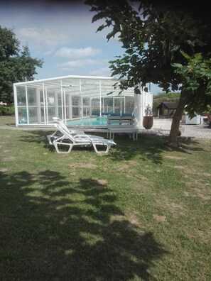 Indoor pool, open 8:30 AM to 9 PM, pool umbrellas, pool loungers