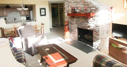 High Ceiling Skyleaf A9 Condo with Fireplace by RedAwning