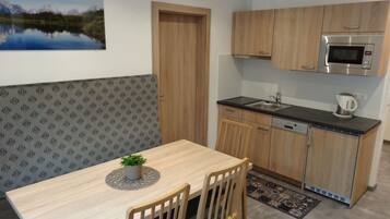 Family Apartment, Multiple Beds | Private kitchenette | Full-sized fridge, microwave, stovetop, coffee/tea maker