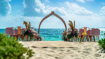 On the beach, white sand, free beach cabanas, sun-loungers