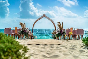 On the beach, white sand, free beach cabanas, sun loungers
