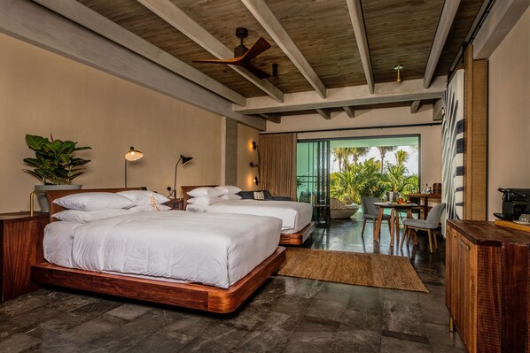 A modern hotel room with two large beds, a wooden ceiling, and a view of palm trees. - Atelier Playa Mujeres - Adults Only - All Inclusive (Punta Sam)