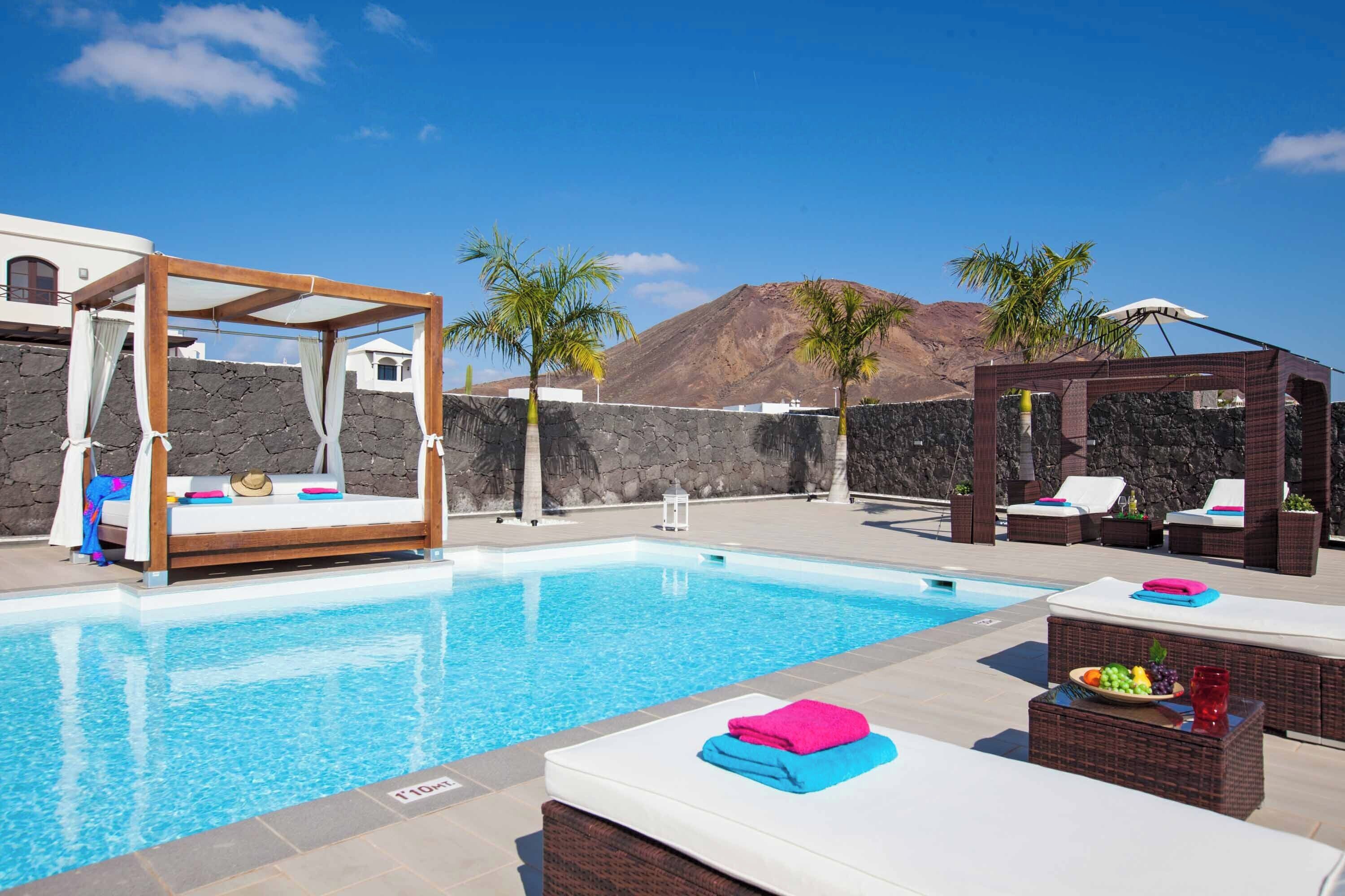 A heated pool, pool loungers