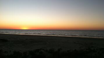 On the beach, sun loungers