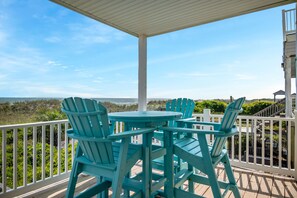 Outdoor dining - Beach Walkers: 5 Bed/3 Bath Sun-Kissed, Oceanfront Home with Three Large Decks (Oak Island)