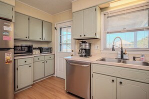 Dishwasher, coffee/tea maker, cookware/dishes/utensils, ice maker - BeachyPeachyKeen.com: 4 Bed/2 Bath Home with Fun Decor and Ocean Views (Oak Island)