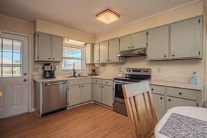 Dishwasher, coffee/tea maker, cookware/dishes/utensils, ice maker - BeachyPeachyKeen.com: 4 Bed/2 Bath Home with Fun Decor and Ocean Views (Oak Island)