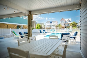 Outdoor dining - A Beach Music Paradise Too: Pool, Outdoor Living Spaces Galore & Ocean Views on (Oak Island)