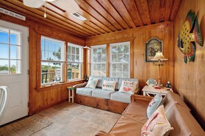 Flat-screen TV, DVD player, books