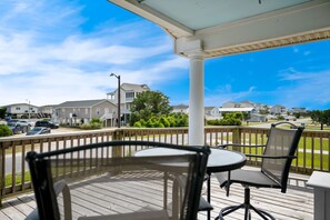 Outdoor dining - Beach Treat: Coastal Chic Home with Spacious Deck, Close to Beach Access (Oak Island)