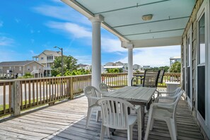 Outdoor dining - Beach Treat: Coastal Chic Home with Spacious Deck, Close to Beach Access (Oak Island)