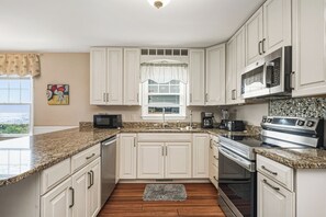 Dishwasher, coffee/tea maker, high chair, cookware/dishes/utensils